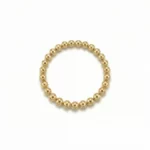 Anillo elástico de bolitas doradas en oro laminado