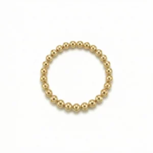 Anillo elástico de bolitas doradas en oro laminado