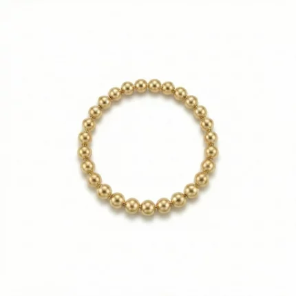 Anillo elástico de bolitas doradas en oro laminado